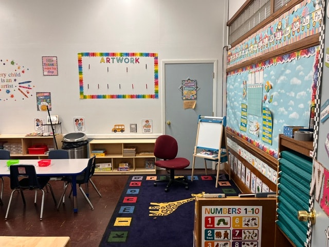 Curé of Ars classroom with Artwork display and Numbers 1-10 rug