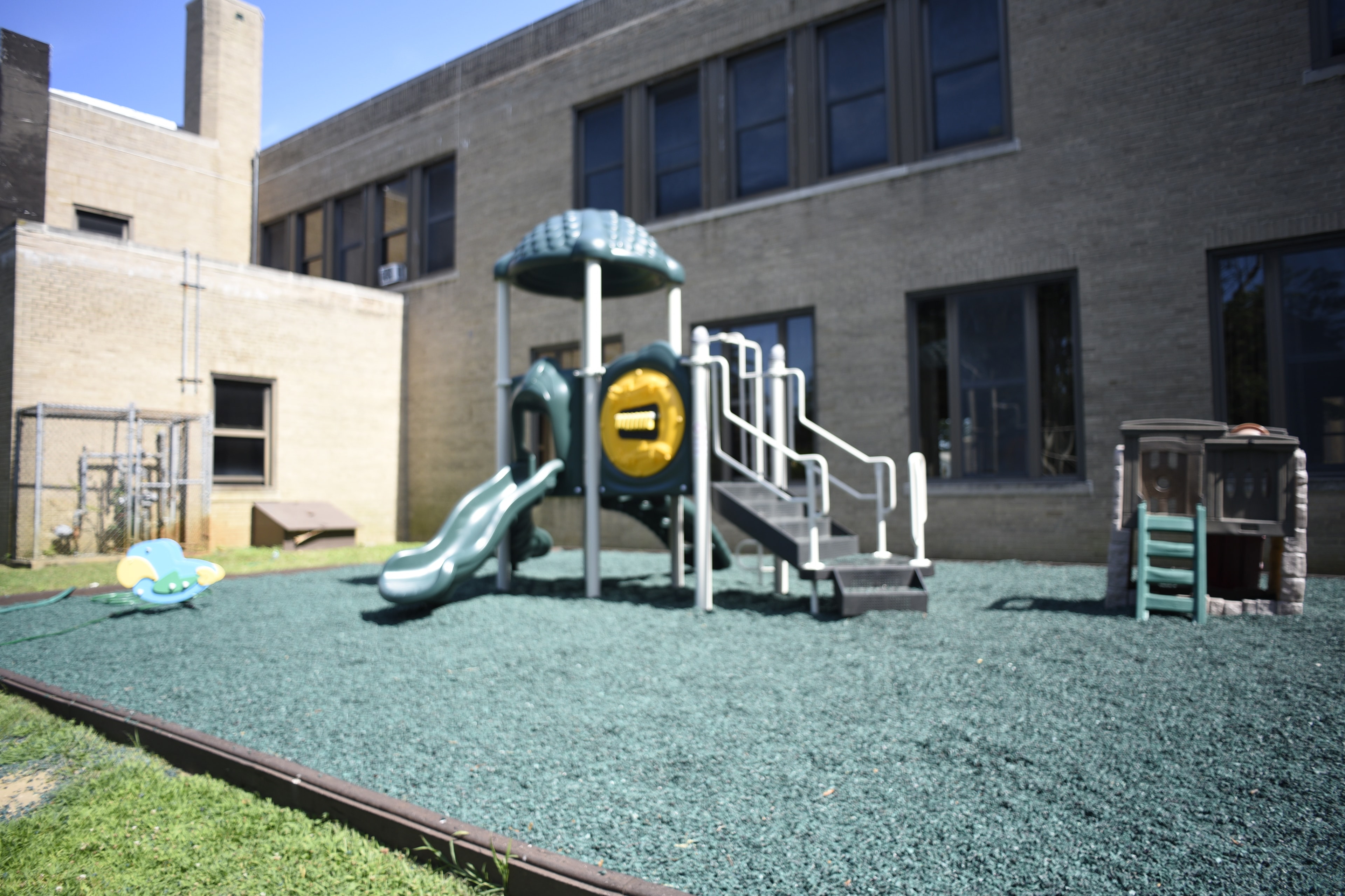 Curé of Ars outdoor playground with slide and climbing structure