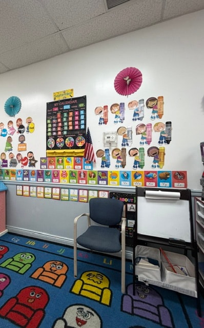 Wantagh preschool classroom with calendar wall and robot rug