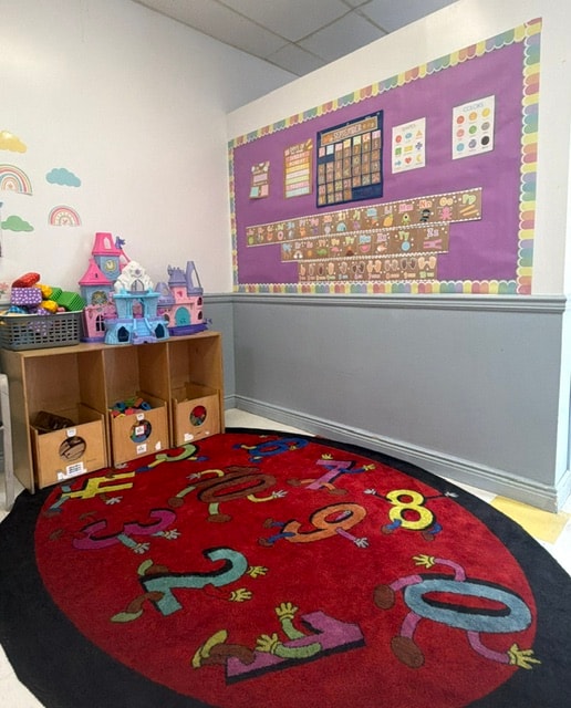 Wantagh classroom with numbers rug and bulletin board